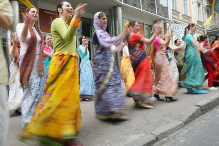 KYIV, UKRAINE - MAY 04: Devotees from Hare Krishna dancing with carnival revelers on Kiev street on May 04, 2008 in Kyiv, Ukraineのeditorial素材