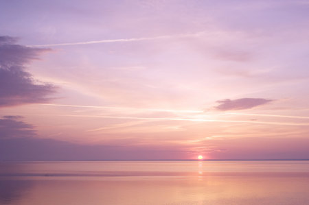 Sunbeams emanating from behind a clouds at suriseの写真素材