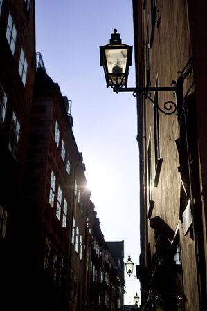 Old fashioned lantern on old Stockholm street ( Gamla Stan )の写真素材