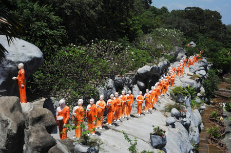 Dambulla, Sri Lanka - Feb 17, 2011:pilgrim statues at Dambulla Golden Temple - It is the largest and...