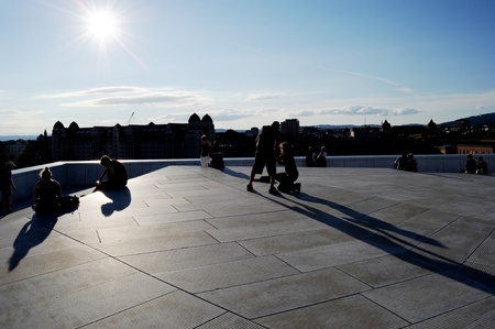 Oslo, Norway - August 15, 2010: People have a rest  at Oslo Opera House.The Oslo Opera House (Norwegian: Operahuset) is the home of The Norwegian National Opera and Ballet, and the national opera theatre in Norway.のeditorial素材