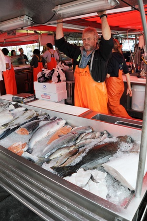 Bergen, Norway - August 17, 2010:  seller at a fish market in Bergen. Norwayのeditorial素材