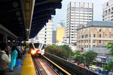 Kuala Lumpur , Malasia - March 16, 2011: Kuala Lumpur LRT train arriving on train station. Kuala Lumpur's metro or rapid transit system consists of 6 metro lines operated by 4 operators.のeditorial素材