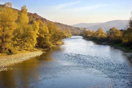 Beautiful autumn mountain river at sunset. Serbiaの写真素材