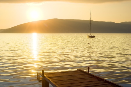 A boat dock in the Adriatic sea at sunset, Herceg Novi, Montenegroの写真素材