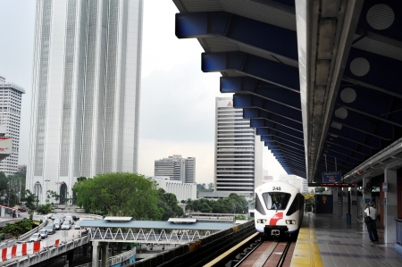  Kuala Lumpur, Malaysia - March 16, 2011: LRT train arrives at a train station  in Kuala Lumpur, Malaysia. Kuala Lumpur metro or rapid transit system consists of 6 metro lines operated by 4 operators. のeditorial素材