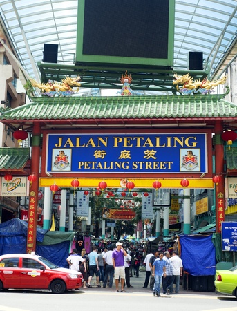 Kuala Lumpur, Malaysia - March 20, 2011: Petaling Street in Kuala Lumpur . The street is a long market which specialises in counterfeit clothes, watches and shoes. Famous tourist attractionのeditorial素材
