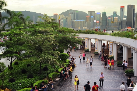 Hong Kong - May 19, 2012:  People at Tsim Sha Tsui at sunset. Tsim Sha Tsui - is a famous tourist destinations. Overall visitor arrivals to Hong Kong in 2011 totalled just over 36 million.のeditorial素材