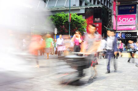 Hong Kong S.A.R. - May 21, 2012: Busy street of Hong Kong . With a land mass of 1,104 km and population of 7 million people, Hong Kong is one of the most densely populated areas in the worldのeditorial素材