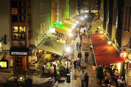 Dresden, Germany - September 19, 2012: The Munzgasse is not only the largest mile of restaurants but also a typical sign of the Saxon hospitality.There you can find cafe and bars, public houses and restaurants, beer gardens and music bars.のeditorial素材