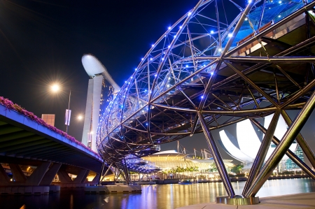 Singapore, Republic of Singapore - March 06, 2013   The Helix Bridge and Marina Bay Sands at night   The Helix is fabricated from 650 tonnes of Duplex Stainless Steel and 1000 tonnes of carbon steel のeditorial素材