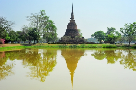 Pagoda reflected in the pond at  Sukhothai Historical Park   Thailandの写真素材