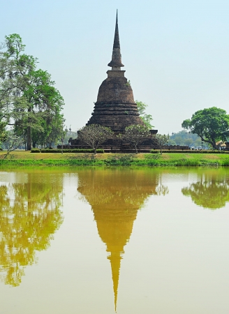 Pagoda reflected in the pond at  Sukhothai Historical Park . Thailandの写真素材
