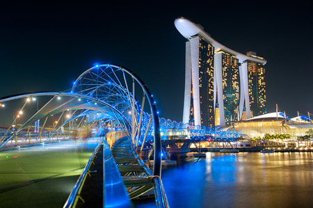 The Helix Bridge and Marina Bay Sands in Singapore. The Helix is fabricated from 650 tonnes of Duplex Stainless Steel and 1000 tonnes of carbon steel.のeditorial素材