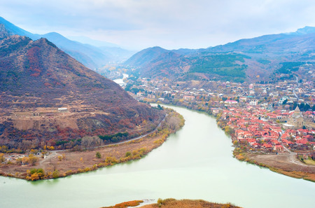 Old georgian town Mtskheta and Caucasus mountain range, Georgiaの写真素材