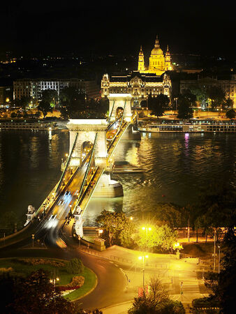 Chain bridge and St Stephen's Basilica at night in Budapest, Hungary  の写真素材