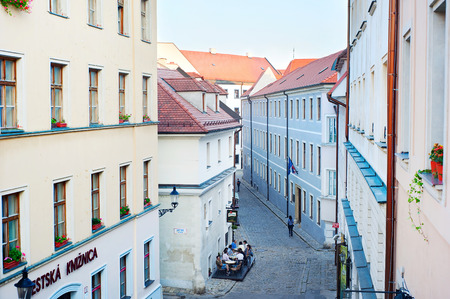 BRATISLAVA, SLOVAKIA - AUGUS 31, 2013: Unidentified people at a street cafe in Old Town of Bratislava. Bratislava is the most visited city in Slovakia. のeditorial素材