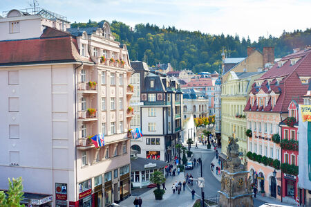 KARLOVY VARY, CSZECH REPUBLIC - SEPTEMBER 20, 2012: People walking on the Old Town street of   Karlovy Vary. Karlovy Vary historically famous for its hot springs (13 main springs, about 300 smaller ) のeditorial素材