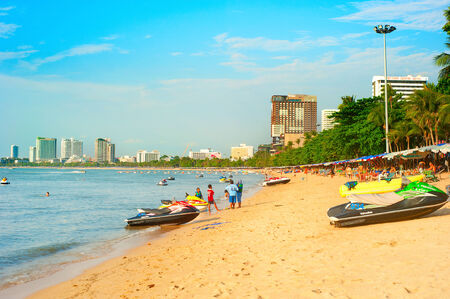 PATTAYA, THAILAND - MARCH 16, 2012: People walking along the beach in Pattaya, Thailand. Almost 20 million tourists visited Thailand in 2012. のeditorial素材
