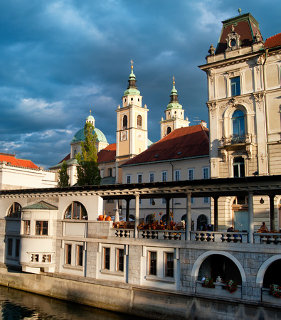 Ljubljana central market and Cathedral with moody sky. Sloveniaの写真素材