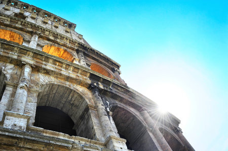 Close-up details of Colosseum with sunbeams. Rome, Italyの写真素材
