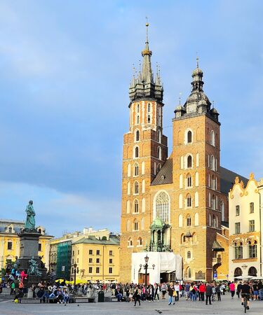 KRAKOW, POLAND - AUGUST27, 2013: Tourists at the Market Square in Krakow . Main Market Square, one of the largest medieval squares in Europe, was built in 1257. のeditorial素材