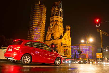 BERLIN, GERMANY - NOVEMBER 15, 2014: Berlin traffic in the evening near the Kaiser Wilhelm Memorial Church.のeditorial素材