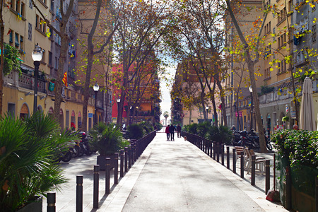 BARCELONA, SPAIN - DEC 17, 2014: Unidentified people walking on the Barcelona street in the morning. Barcelona is the capital city of the autonomous community of Catalonia in Spain with a population of 1.6 millionのeditorial素材