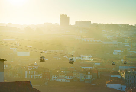 Modern cable cars in Porto at sunset. Gaia city on the background. Portugalの写真素材