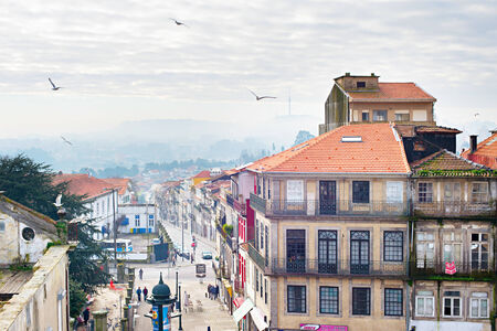 PORTO, PORTUGAL - JAN 14, 2015: People walking on the street of Porto Downtown. Porto, also known as Oporto, is the second-largest city in Portugal.のeditorial素材