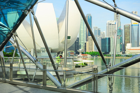 SINGAPORE - MAY 07, 2013: Worker cleaning the Helix bridge in front of Singapore downtown. The Helix is fabricated from 650 tonnes of Duplex Stainless Steel and 1000 tonnes of carbon steel.のeditorial素材