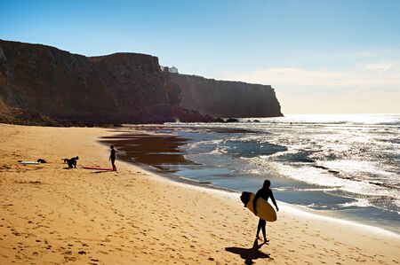 Surfer on the beach in the sunshine day. Portugalの写真素材