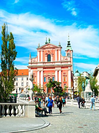 LJUBLJANA, SlOVENIA - SEPT 02, 2013 : People walking at Triple Bridge and Preseren Square in Ljubljana, Slovenia - famous tourist destination.のeditorial素材