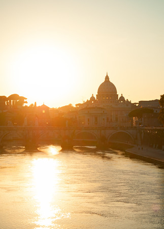 Sunset view of Tiber river and St. Peter's cathedral. Vatican, Romeの写真素材