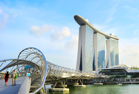 SINGAPORE - MAY 03, 2013 : The Helix Bridge and Marina Bay Sands in Singapore. Marina Bay is billed as the world's most expensive standalone casino property at S$8 billionのeditorial素材