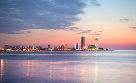 Skyline of Batumi at sunset with reflection in the sea. Georgiaの写真素材