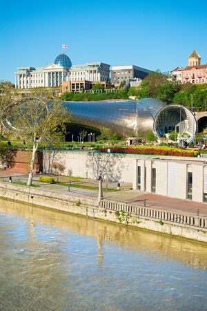 View of Concert Hall and the Official residence of Georgian President on the bank of Kura river in Tbilisi, Georgiaのeditorial素材