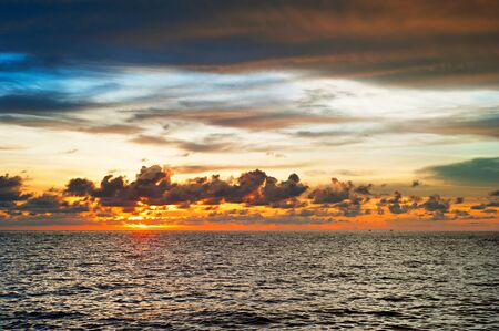 Dramatic colorful sunset over the sea in Thailandの写真素材