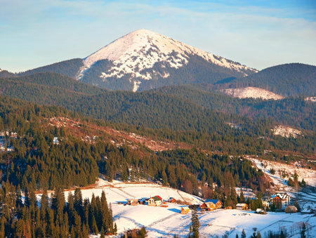 Carpathians mountain village in the winter at sunset. Ukraine