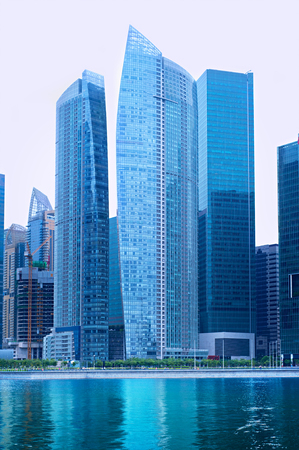 Office buildings at Singapore Downtown Core with reflection in a riverのeditorial素材