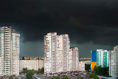 Urban landscape with black stormy clouds in th sky