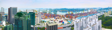 Panoramic view of Singapore commercial port with modern skyscrapers on foreground