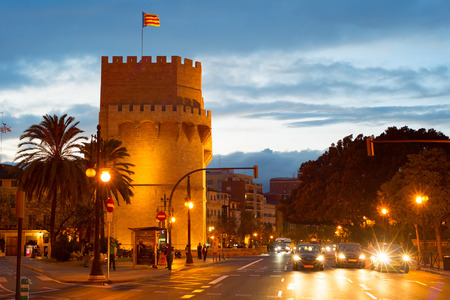 VALENCIA, SPAIN - NOV 06, 2016: Road traffic near Serrano Towers (Torres de Serranos) at twilight. Towers are located on Plaza de los Fueros in Valencia, Spainのeditorial素材