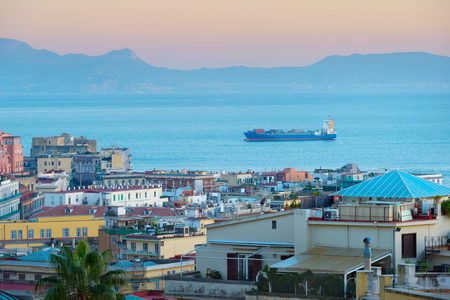 Tanker full of containers in arrive to Naples sea port. Italyの写真素材