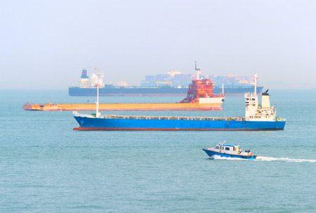 Many industrial cargo ships in Singapore harborのeditorial素材