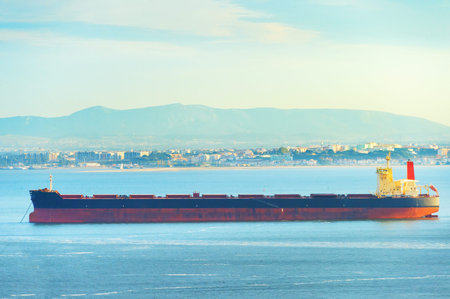 Large cargo shipping tanker on Tagus river in Lisbon, Portugalの写真素材