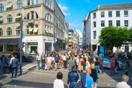 COPENHAGEN, DENMARK - JUNE 14, 2018: People crossing the road at Copenhagen central shopping street. Copenhagen is the capital of Denmark.のeditorial素材