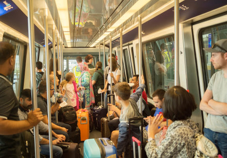 FRANKFURT, GERMANY - AUGUST 29, 2018: People traveling inside train between terminals in Frankfurt...
