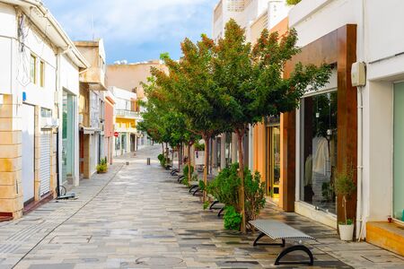 Shopping street in central touristic district of Paphos with green trees, Cyprusの写真素材