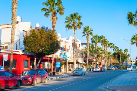 PAPHOS, CYPRUS - FEBRUARY 13, 2019: Shopping street along the road in Paphos, Cyprusのeditorial素材